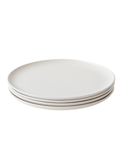 A set of four Goun Plates in speckled moon-white ceramic, by Soilbaker for Material.