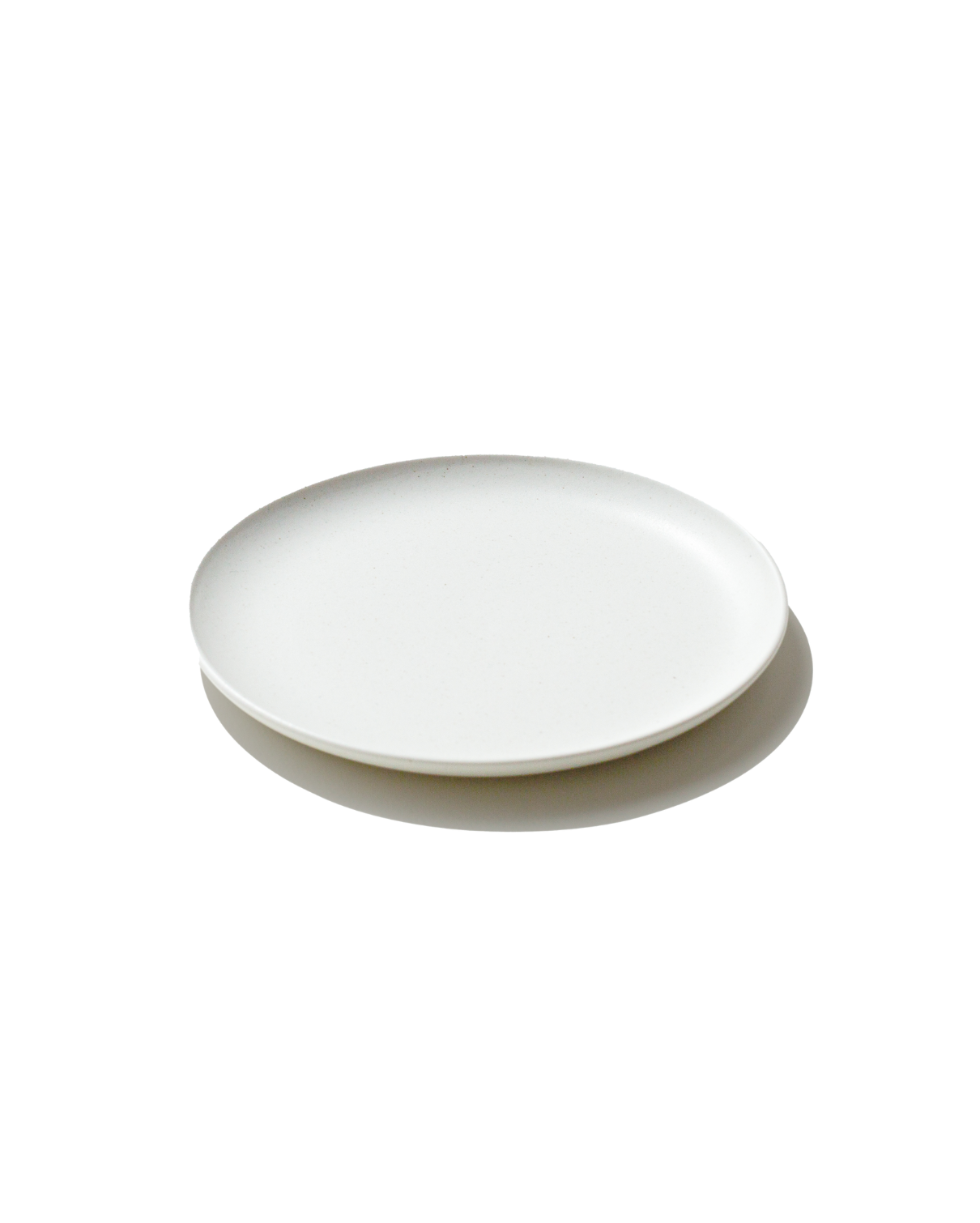 The Small Goun Plate — speckled moon-white ceramic dessert and salad plate by Soilbaker for Material.