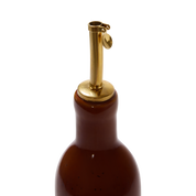 Tortoiseshell Oil Cruet — gold-tone stainless steel pour spout on glossy amber ceramic bottle