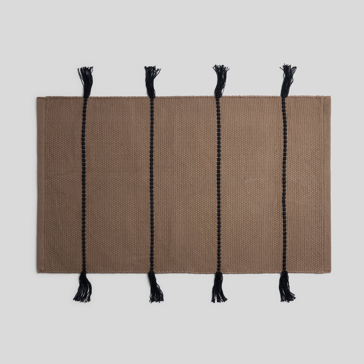 Organic Tassel Bath Rug in Warm Grey and Soft Black by Parachute Home — view 1