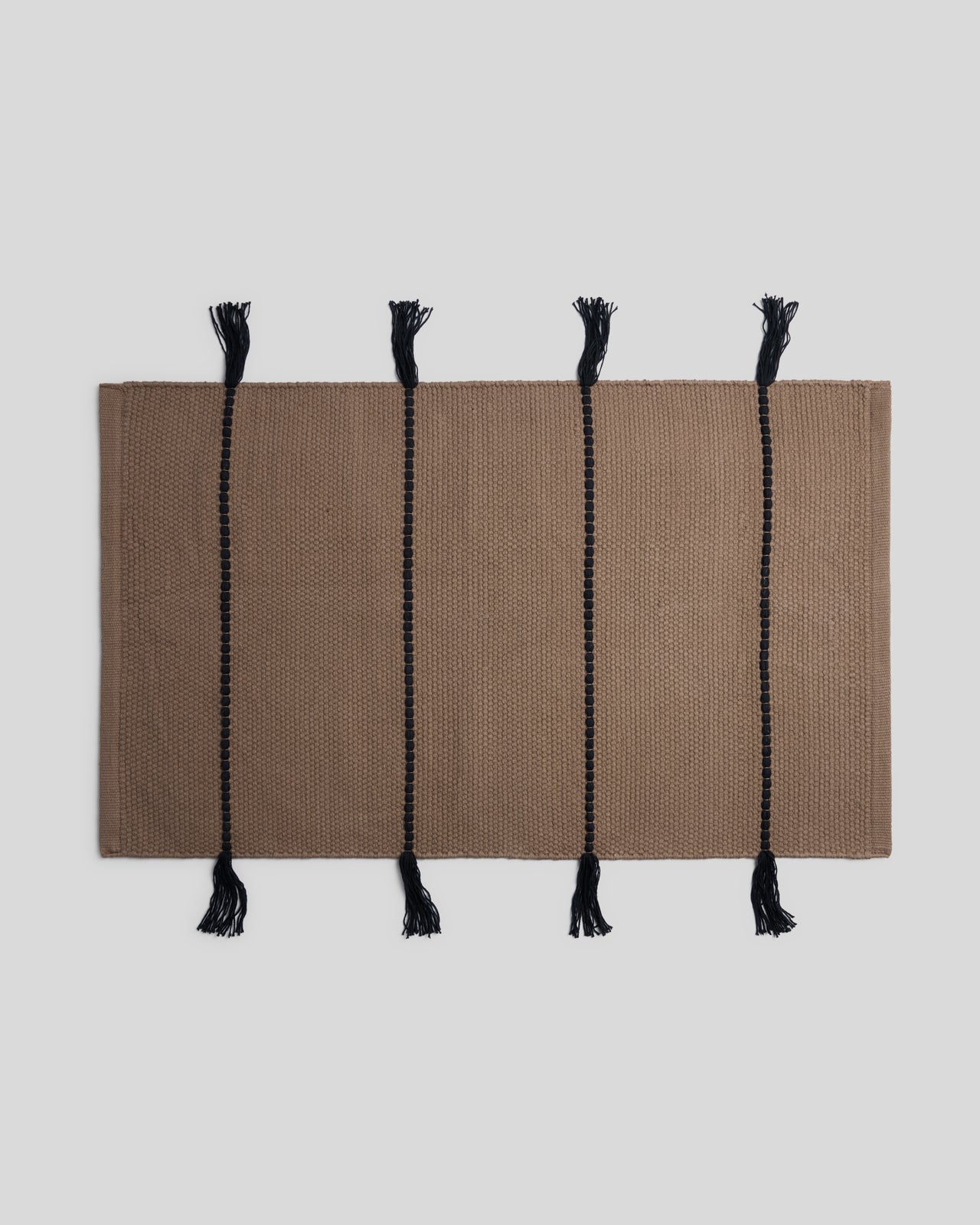 Organic Tassel Bath Rug in Warm Grey and Soft Black by Parachute Home — view 1