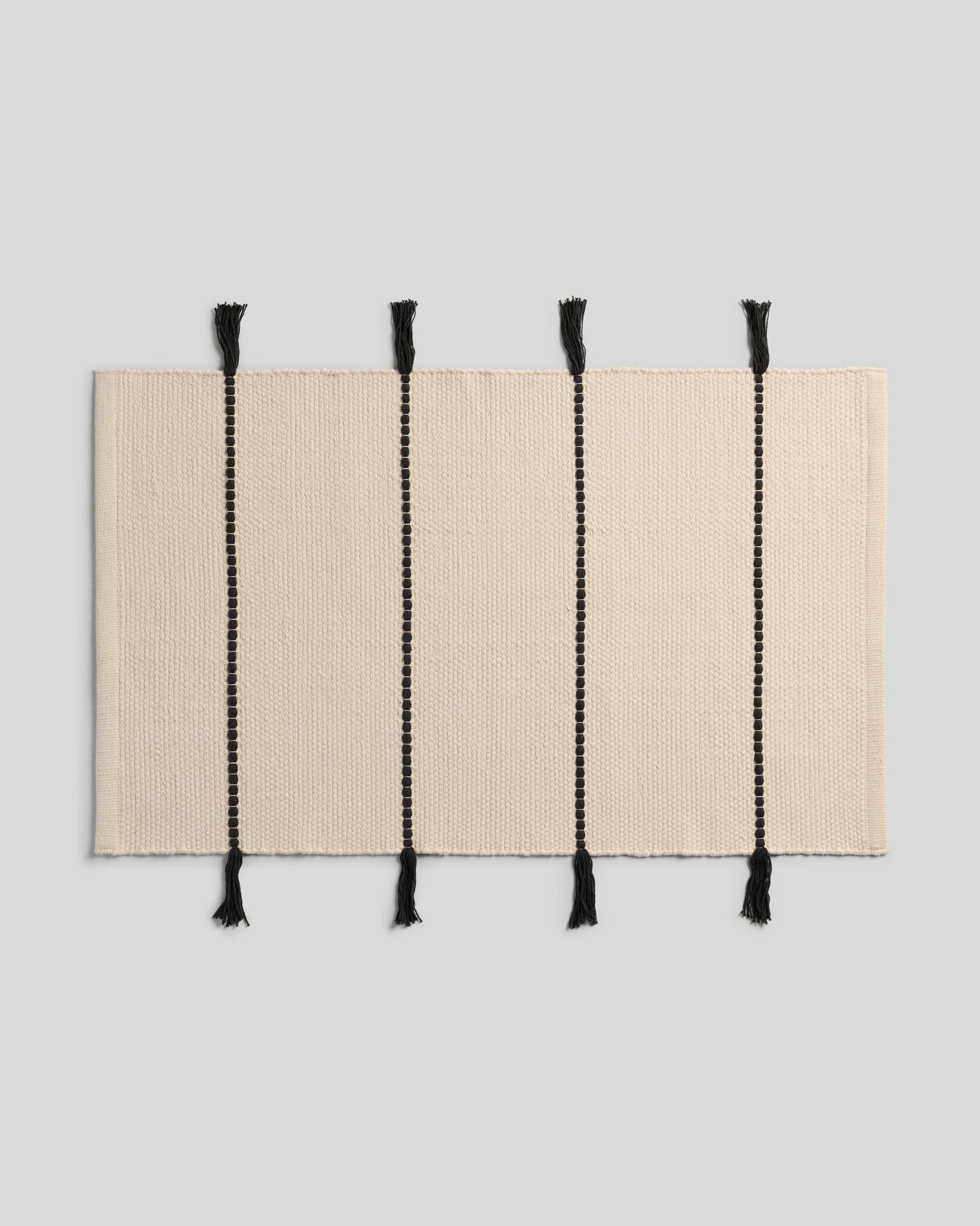 Organic Tassel Bath Rug in Natural and Onyx by Parachute Home — view 1