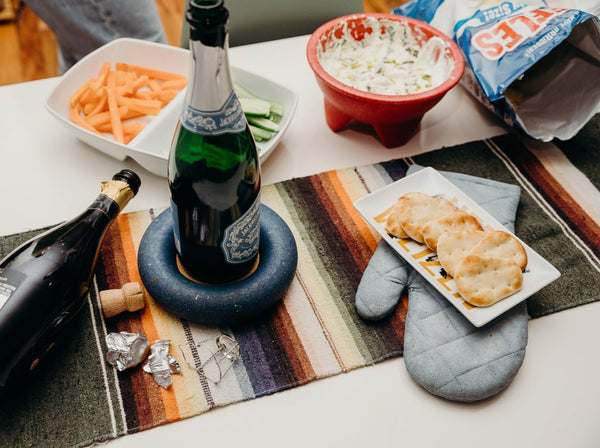 Snack spread with coasters and trivets