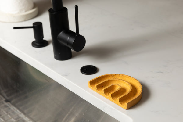 Marigold wavy soap dish at a kitchen sink