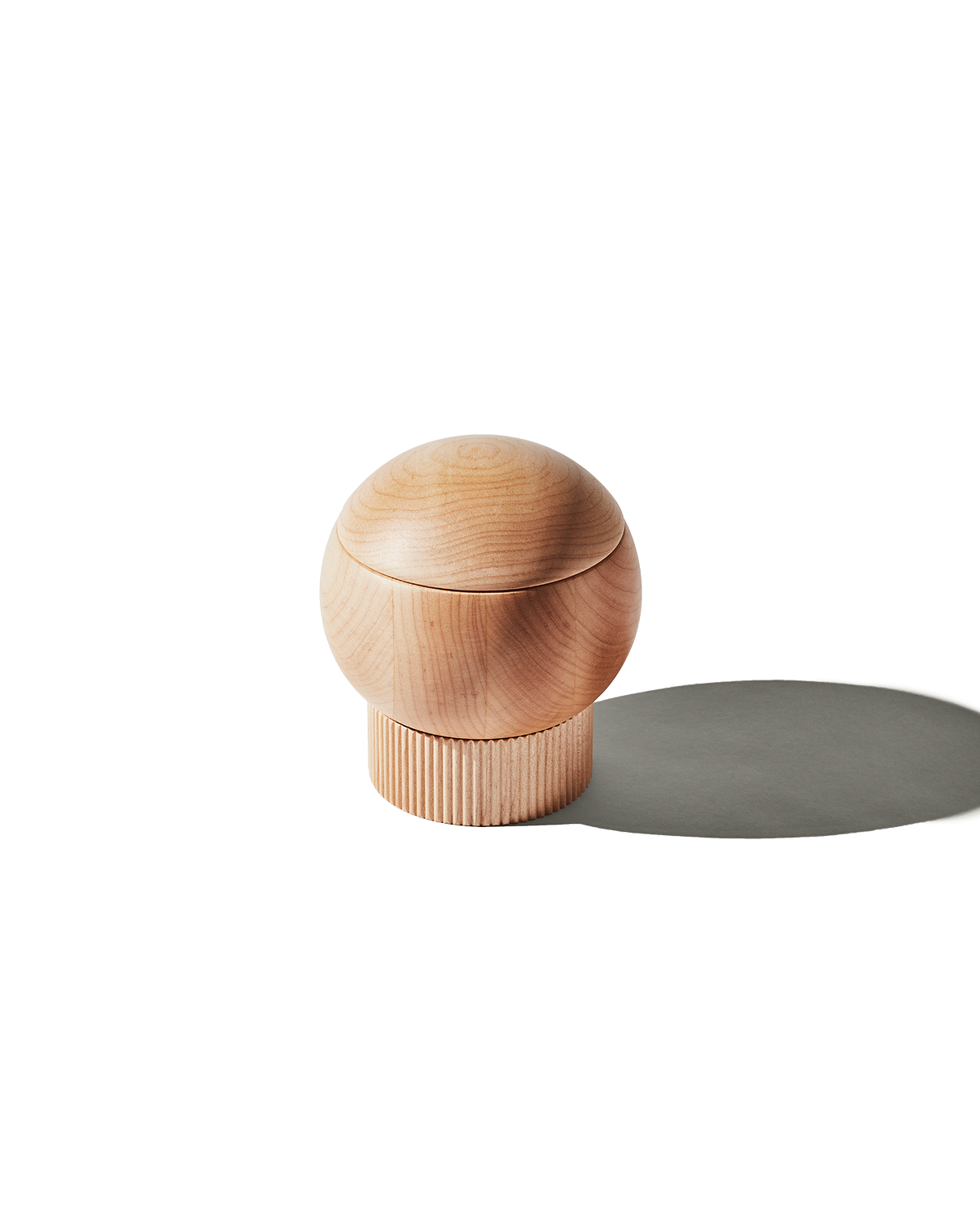 The Salt Sphere salt cellar in Maple wood, from Material — magnetic swivel lid and fluted stackable base.