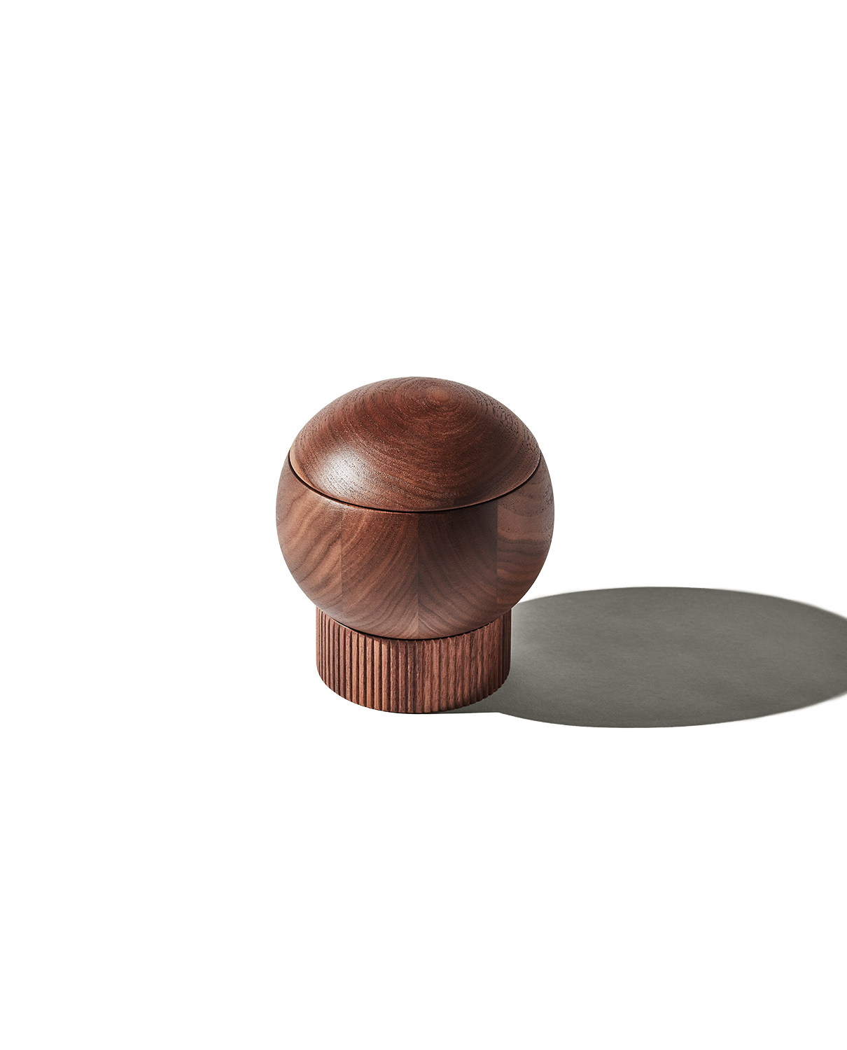 The Salt Sphere salt cellar in Walnut wood, from Material — magnetic swivel lid and fluted stackable base.